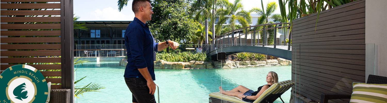 Couple sitting by pool | Facility Amenities at Mindil Beach Casino Resort