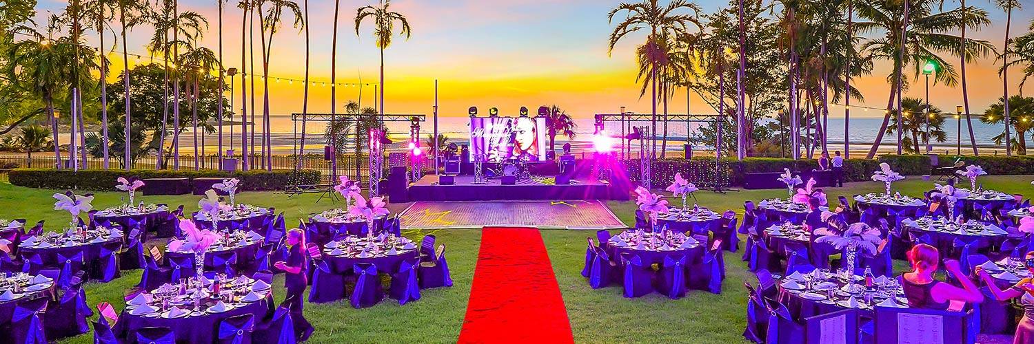 Outdoor event set-up with tables and stage | Oceanside Events | Darwin, Australia